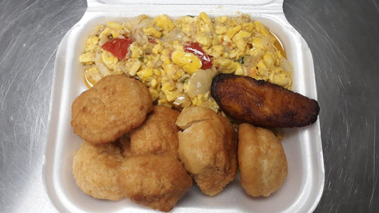 Ackee & Saltfish served with Fried Dumplings- (LG) Well seasoned ackee & salted cod fish, and crispy, golden dumplings, this traditional dish is sure to satisfy your taste buds. Enjoy the savory flavors and cultural experience with every bite.