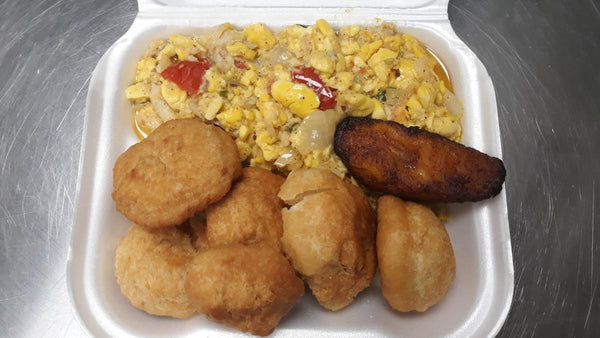 Ackee & Saltfish served with Fried Dumplings- Well seasoned ackee & salted cod fish, and crispy, golden dumplings, this traditional dish is sure to satisfy your taste buds. Enjoy the savory flavors and cultural experience with every bite.