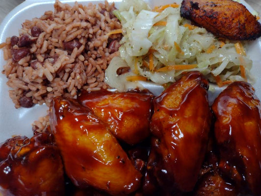 B-B-Q Chicken Wings Combo 10 pcs. Served with rice and peas, stewed cabbage, and plantains.