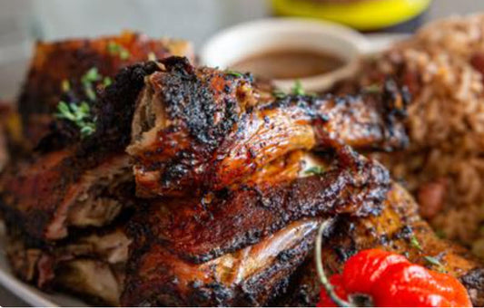 (2) Jerk Chicken 1/2 Dinners. Tender spicy Jerk Chicken, served with a side of flavorful stewed cabbage, rice and peas, and sweet plantain. Top it off with our rich ox tails gravy, and you have a delicious and satisfying meal.