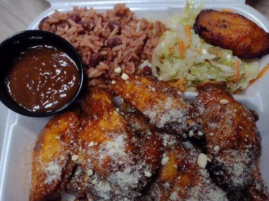 Parmasean Jerk Chicken Wings Combo 10pcs. Served with rice and peas, stewed cabbage, and plantains.