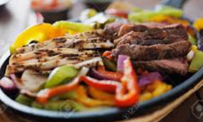 Wicked Steak & Chicken Fajitas! Tender, juicy steak and succulent chicken, perfectly seasoned and grilled to perfection. Sauteed with onions and green peppers. Includes guacomole, sour ceam, cheese, pico de gallo, rice and beans.