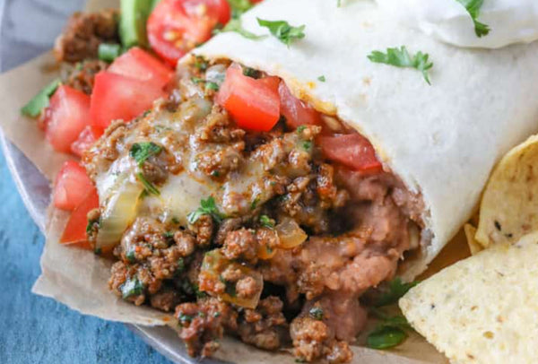 Wicked Ground Beef Buritto- Made with high-quality ground beef, fresh lettuce, flavorful rice, pico de gallo, creamy sour cream, and cream cheese, all wrapped in a soft white flour tortilla.