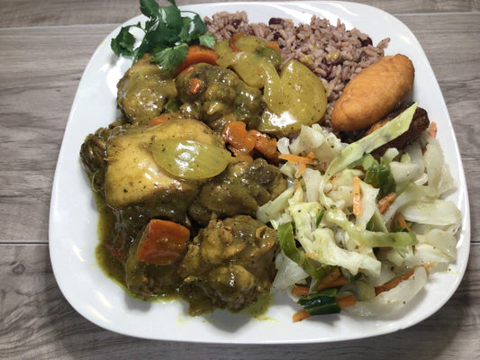 (2) Curry Chicken Dinners! Each dish comes with perfectly seasoned chicken in a rich curry sauce, served with a mouthwatering side of Rice & Peas, flavorful Stewed Cabbage, delicious Festival, and sweet Plantain.