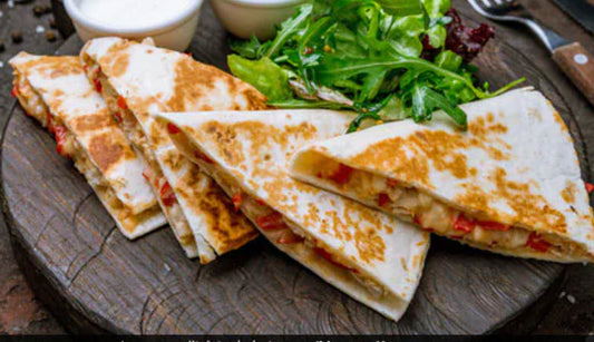 Wicked Philly Cheese Steak Quesadilla- Our Philly Cheese Steak Quesadilla. Tender seasoned steak, sauteed with onions and green peppers, layered on a bed of cheese, and pressed between 2 warm flour tortillas.
