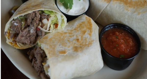 Wicked Steak Buritto-  Made with high-quality seasoned Steak, flavorful rice, fresh lettuce, and a mouth-watering combination of pico de gallo, and sour cream, all hand-wrapped in a soft white flour tortilla.