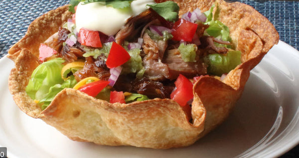 Wicked Fajita Salad Bowl (Steak)-Taco shell nestled with lettuce, pico de gallo, cheese, sour cream, guacamole, corn salsa and, house dressing. Served with well seasoned tender strips of Steak with green peppers and onions on the side.